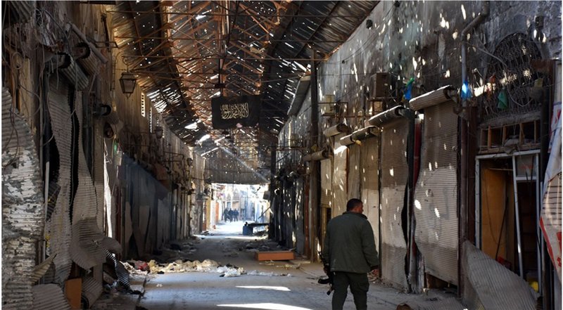 A devastated corridor of Aleppo’s historic souq, capturing the loss of a once-vibrant public realm.
