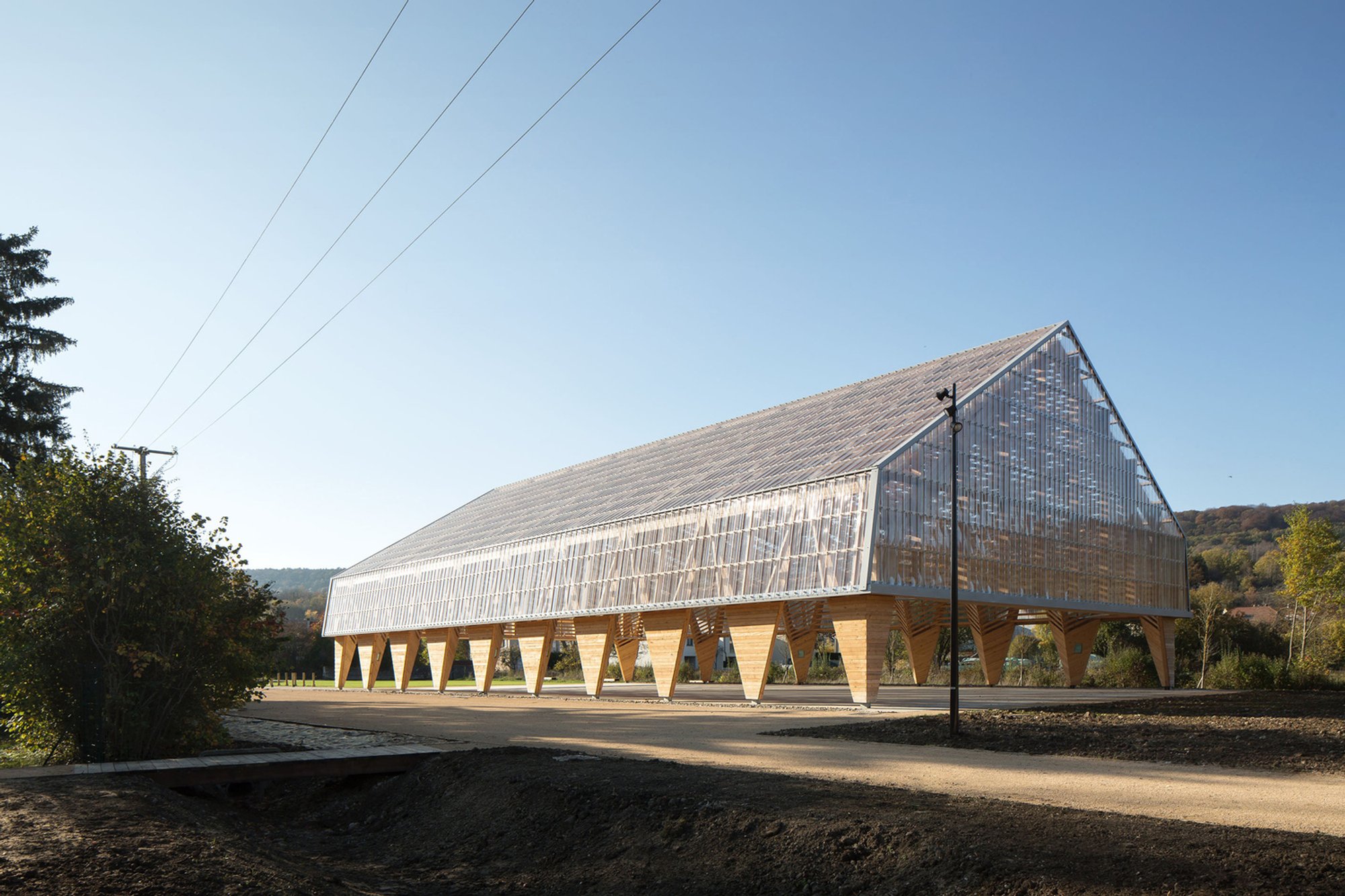 Wooden Hall in Ancy-Dornot by Studiolada – A Multi-Functional Timber Pavilion in France