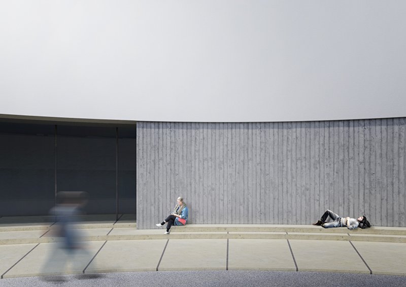Visitors resting beneath the hovering form in the quiet courtyard.