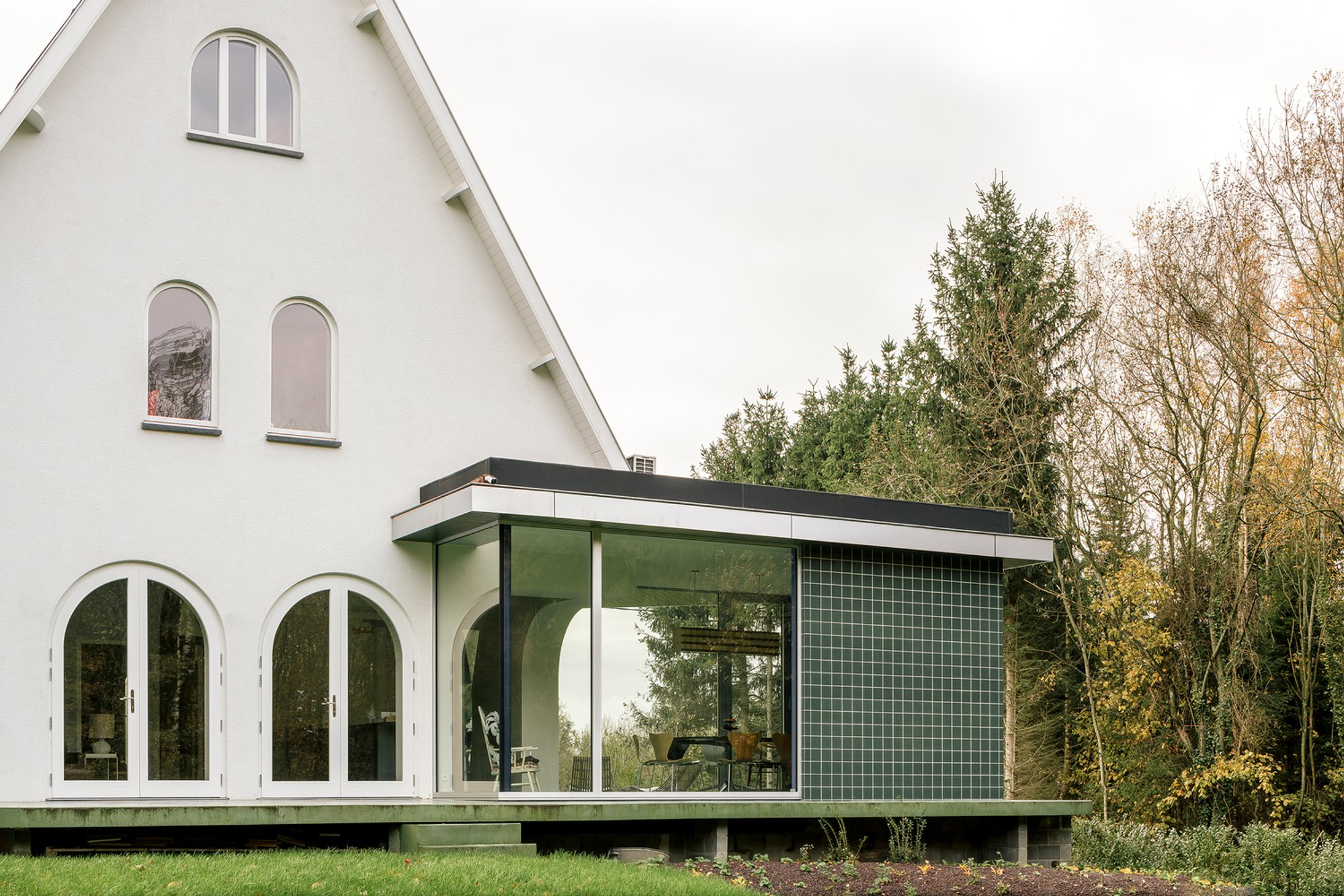 Sofie House: A Green Concrete House Renovation Balancing Heritage and Contemporary Design