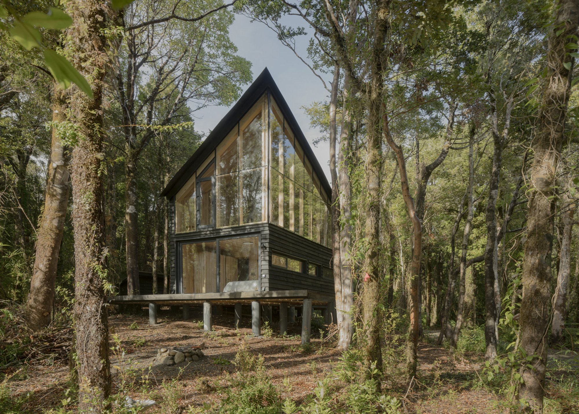 Modern Cabin Design in the Forest: Refugio Calfuco by Tomás de Iruarrizaga