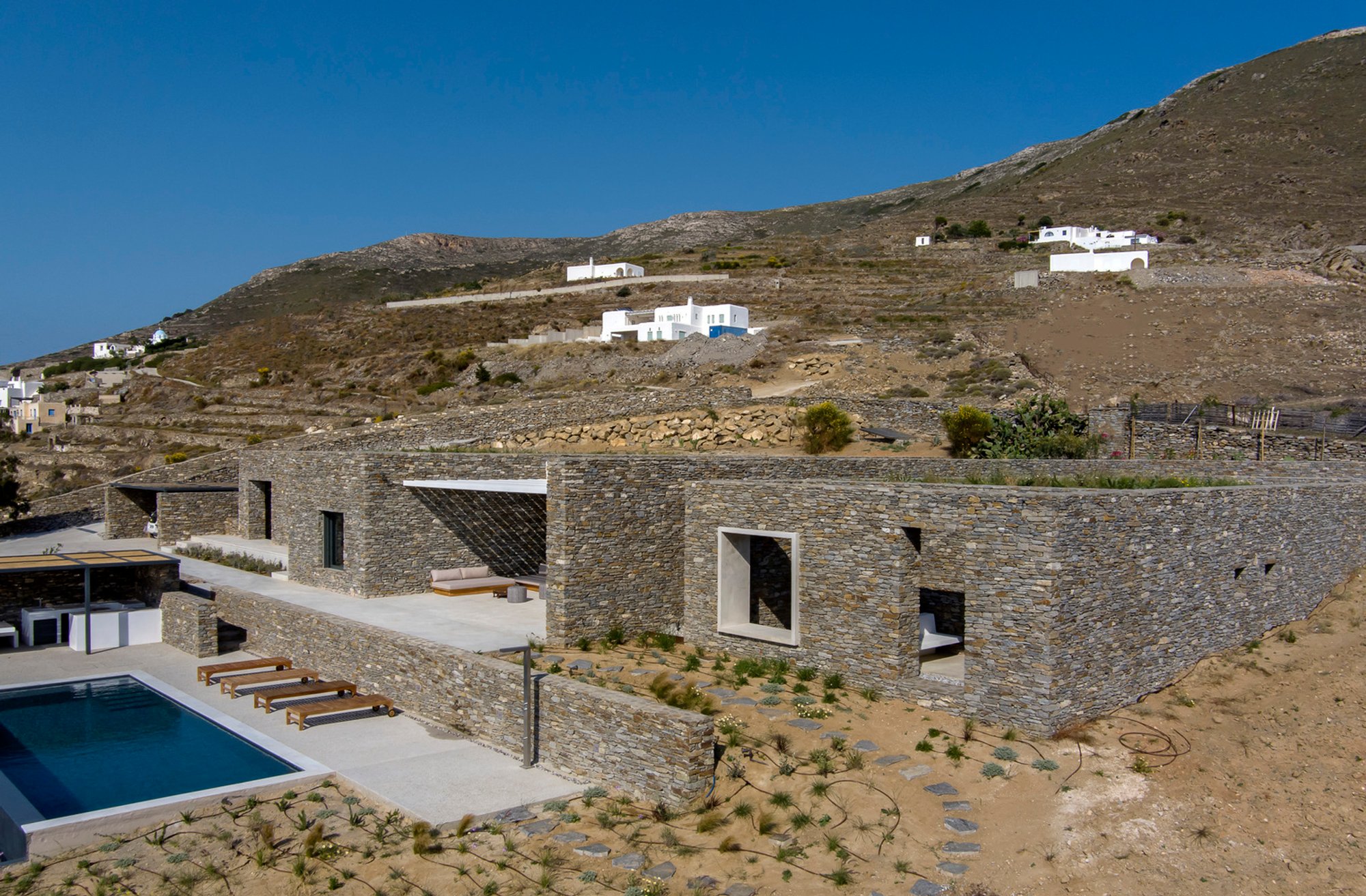 Cycladic Stone House Design: PetrA Home by React Architects in Paros, Greece