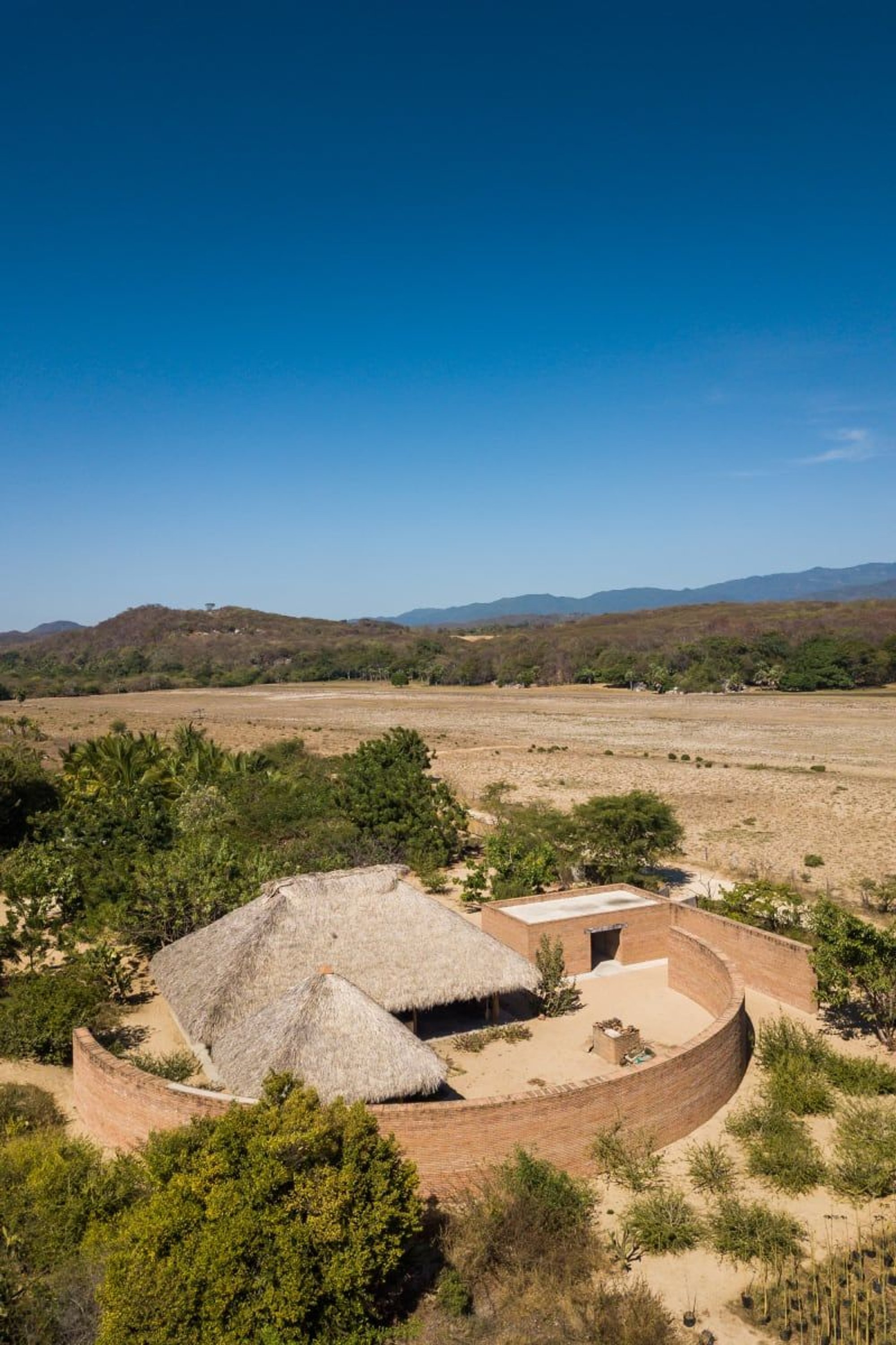 The Clay Pavilion by Álvaro Siza + BAAQ': A Sculptural Brick Sanctuary for Tradition and Community