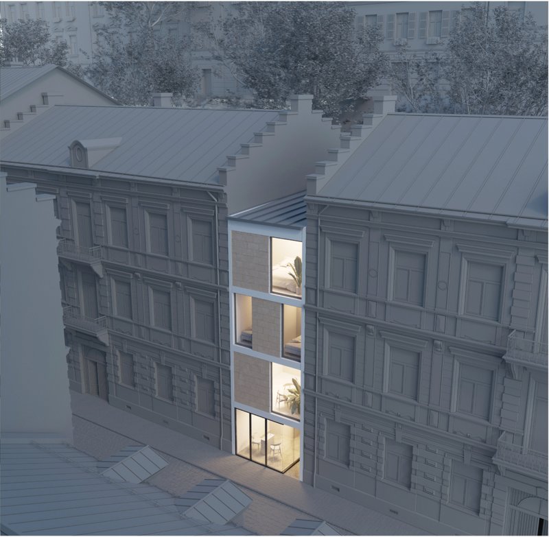 Compact urban infill blending modern design within historic context.