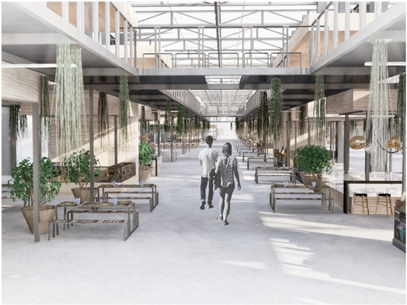 Light-filled circulation space connecting community workshops and gathering areas.