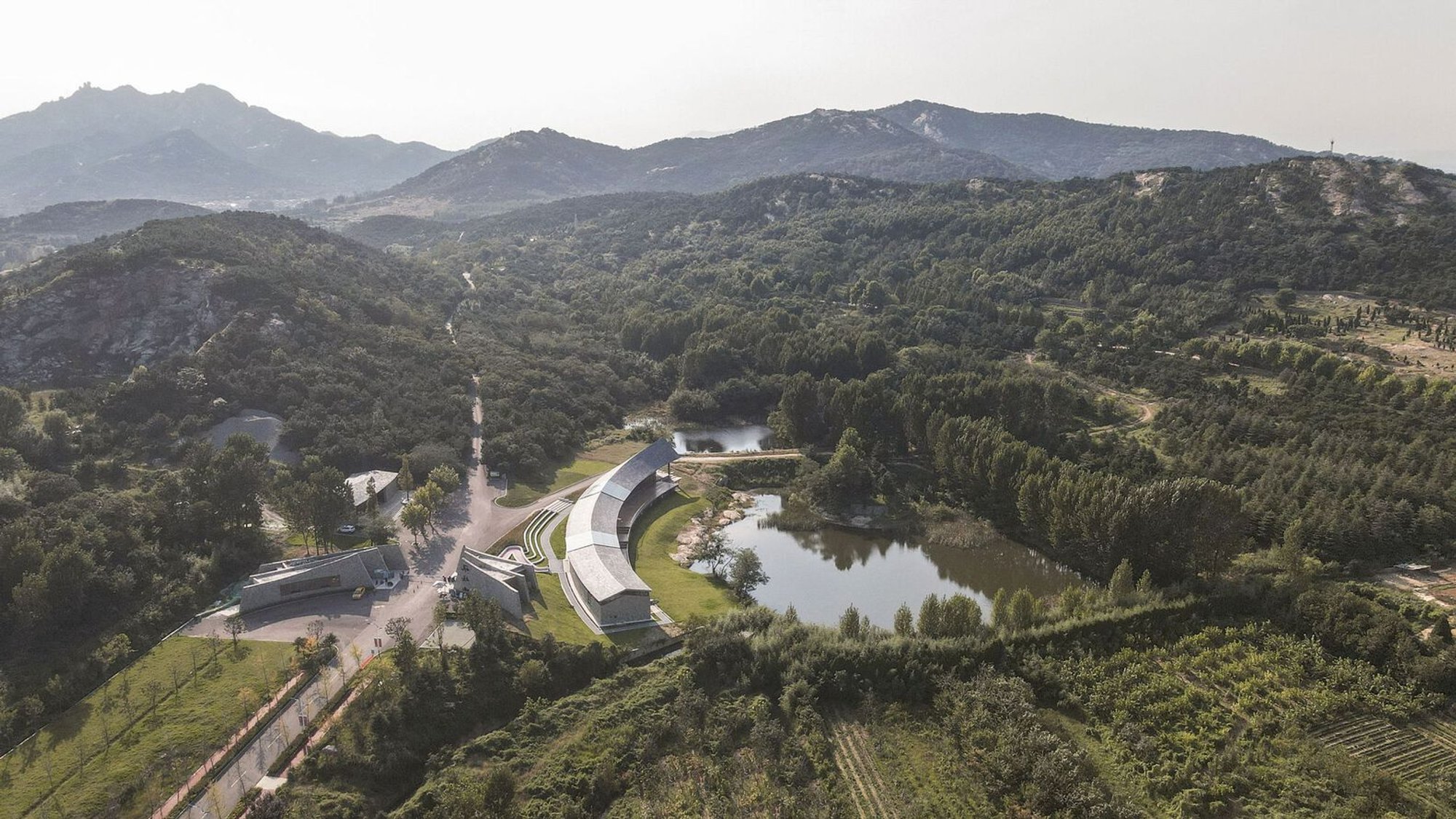 Dragon Mountain Tourist Center by Aurelien Chen: Architecture Rooted Between Earth and Sky
