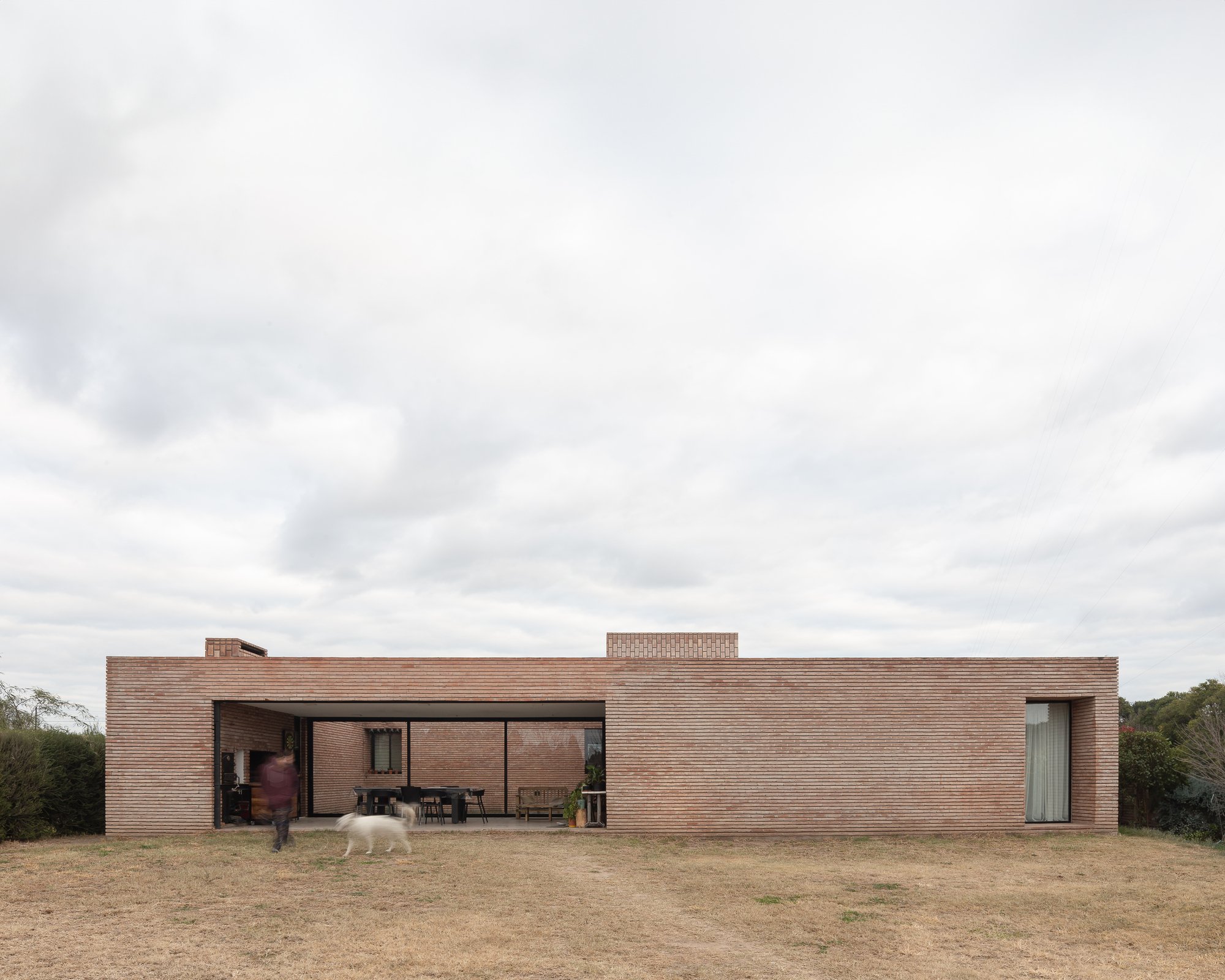 Three Courtyards House: Nested Brick Thresholds and Spatial Depth