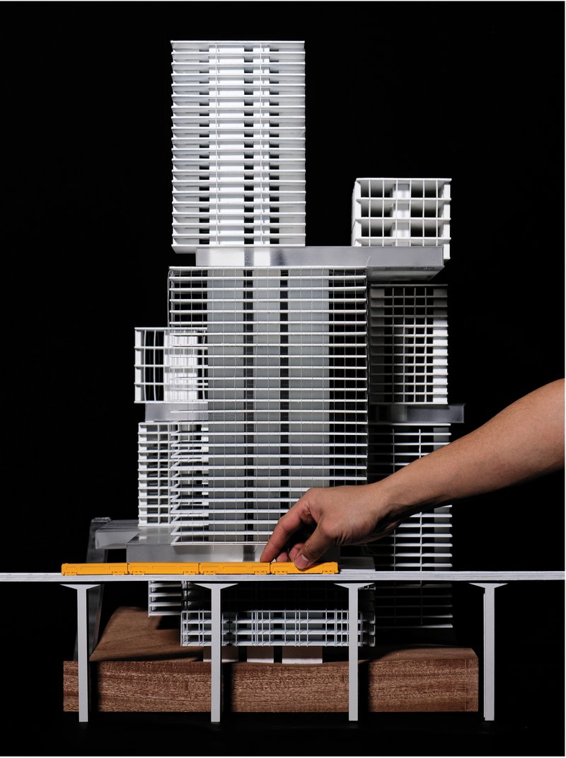 Physical model of the mixed use tower cluster connected by a public cultural loop along the Miami Riverfront.