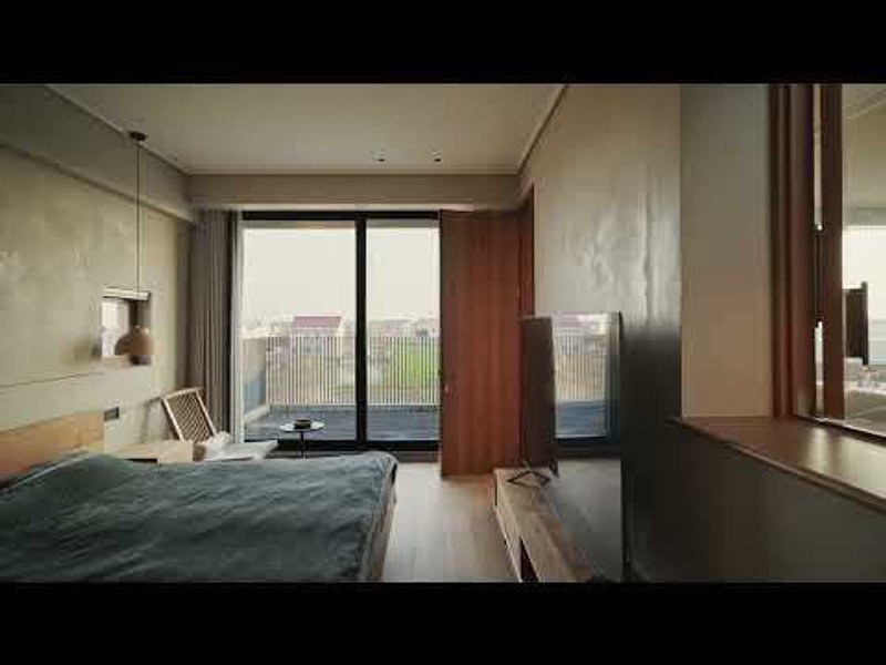 Bedroom with textured plaster walls, sliding glass doors to a balcony and timber divider panel