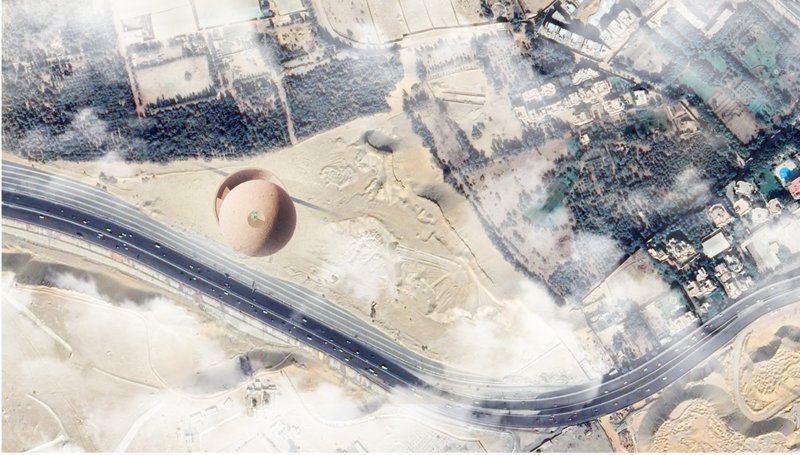 Aerial view reveals isolated placement of the memorial within urban and desert edge conditions