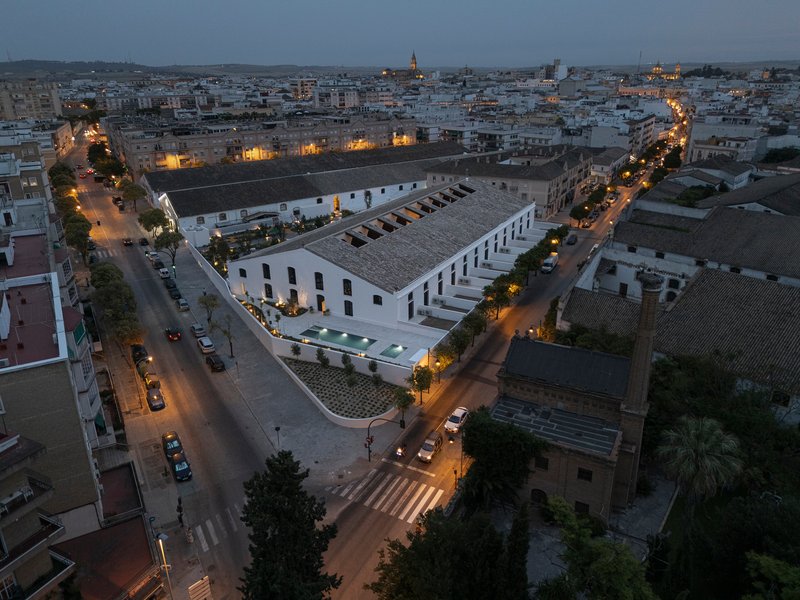 Aerial dusk view of the converted sherry bodega complex in Jerez de la Frontera