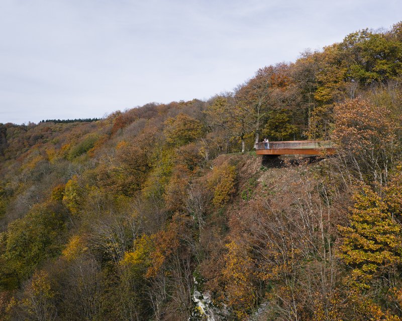 Distant side view of the cantilevered overlook from across the valley