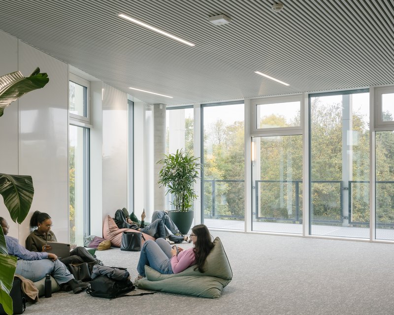 Informal lounge with bean bags and a fully glazed corner