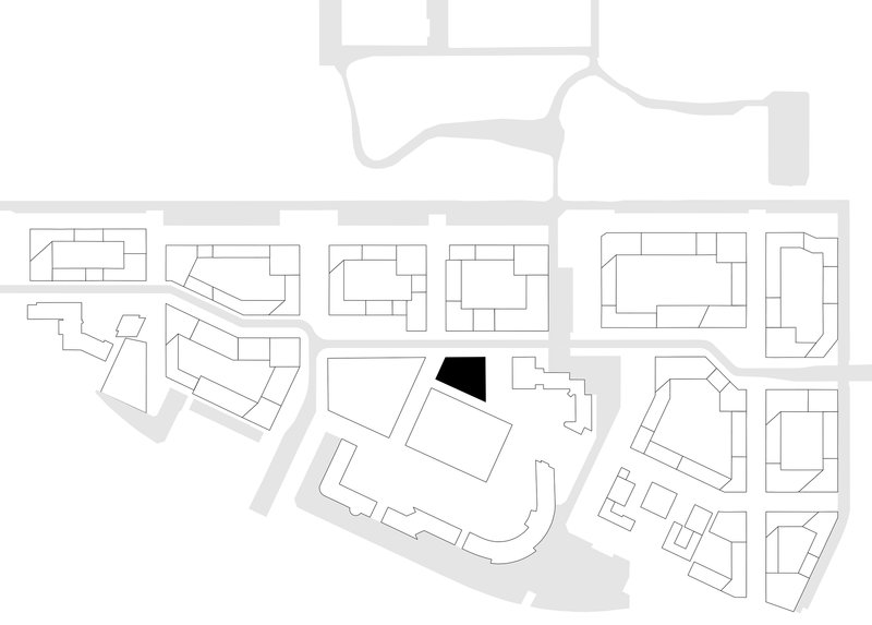Site plan drawing showing building footprint in black within surrounding urban block structure