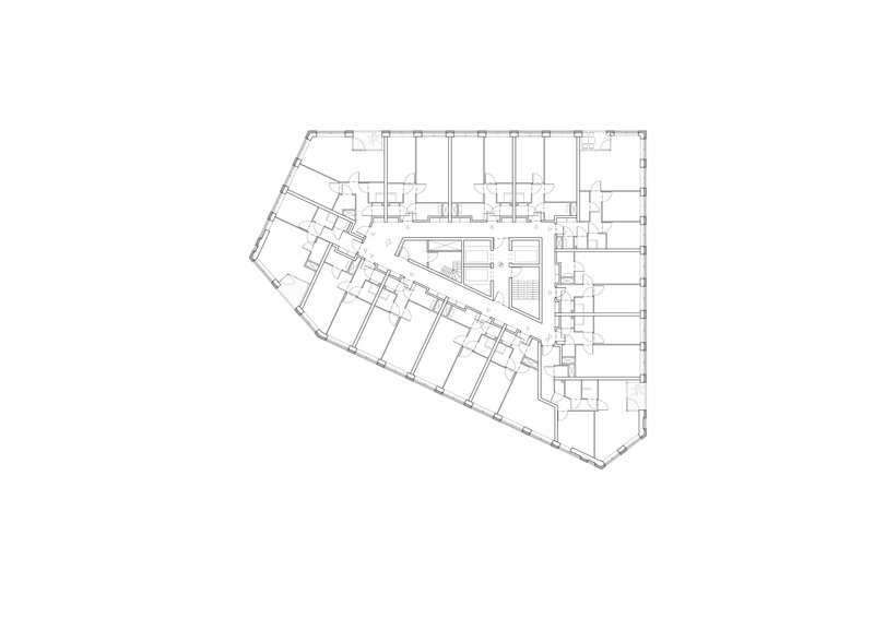 Floor plan drawing showing triangular perimeter with diagonal corridor dividing office spaces from central services