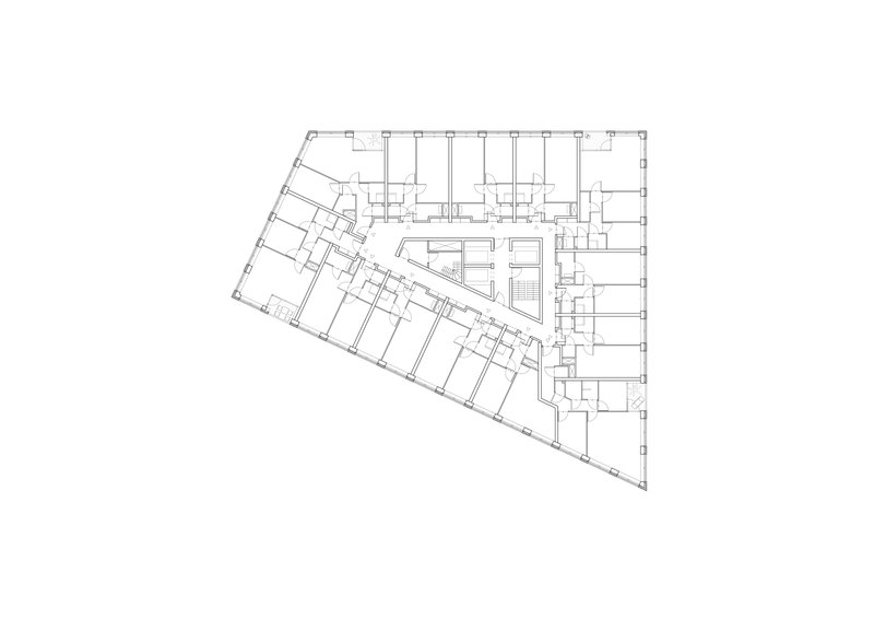 Floor plan drawing showing angled wing of open-plan spaces alongside cellular rooms and central stair
