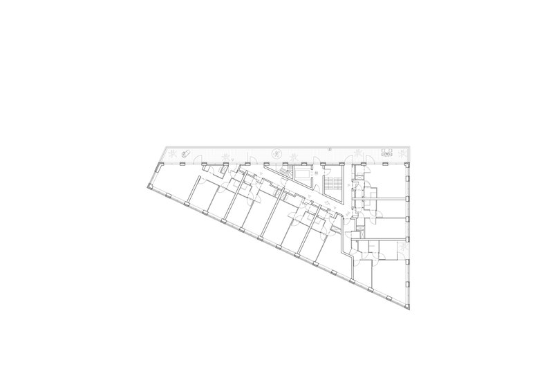 Floor plan drawing showing upper level with angled perimeter and central circulation core