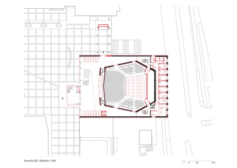 Ground floor plan drawing showing central auditorium seating with angled walls and surrounding circulation