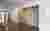 This architectural image showcases a modern hospital corridor with a minimalist design. The space fe