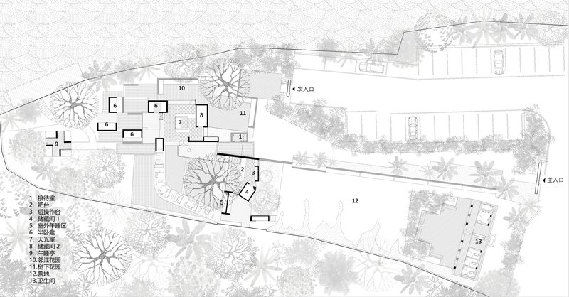 Site plan drawing showing scattered building clusters and parking areas across a sloped landscape with trees