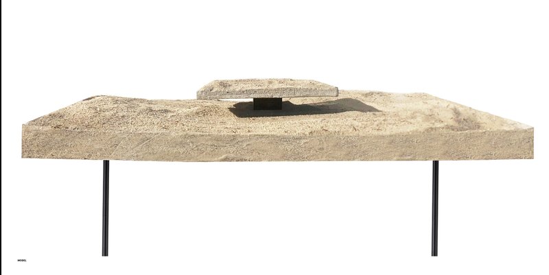 Physical model illustrating the monument as a framed fragment of earth suspended in transition.