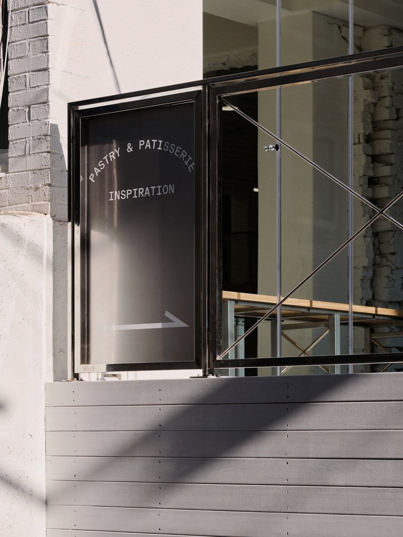 Detail of the entrance terrace with a Pastry & Patisserie Inspiration sign