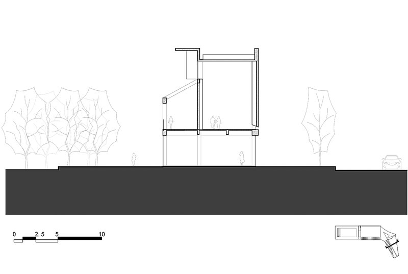 Section drawing revealing two-story volume with angled roof plane and trees on either side