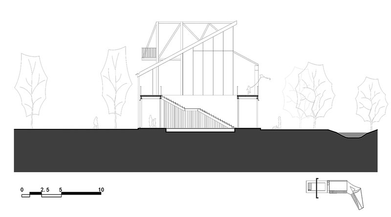 Section drawing depicting angular truss roof over hall space with descending stepped seating area