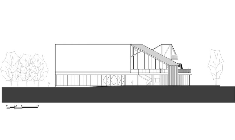 Section drawing showing the sloped roof structure above vertical slatted screens with trees flanking the building
