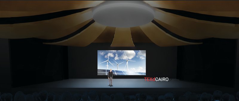 Auditorium stage hosting climate-focused presentations and talks