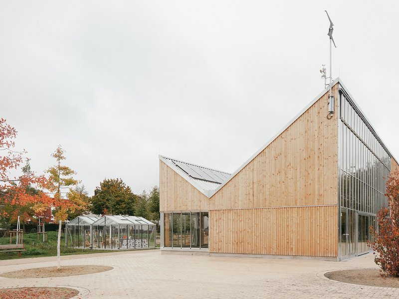 Side elevation showing the timber volume meeting the glazed greenhouse hall