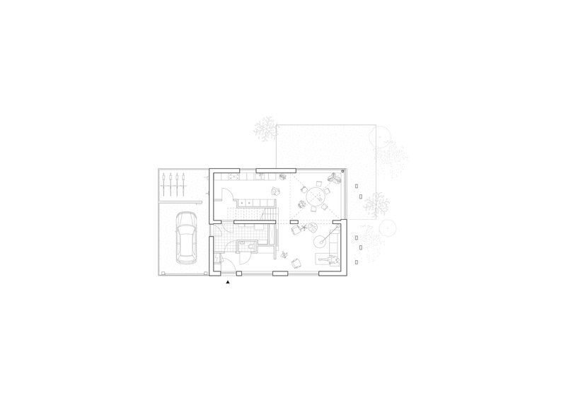 Ground floor plan drawing showing open living spaces, carport, and central staircase with furnishings indicated