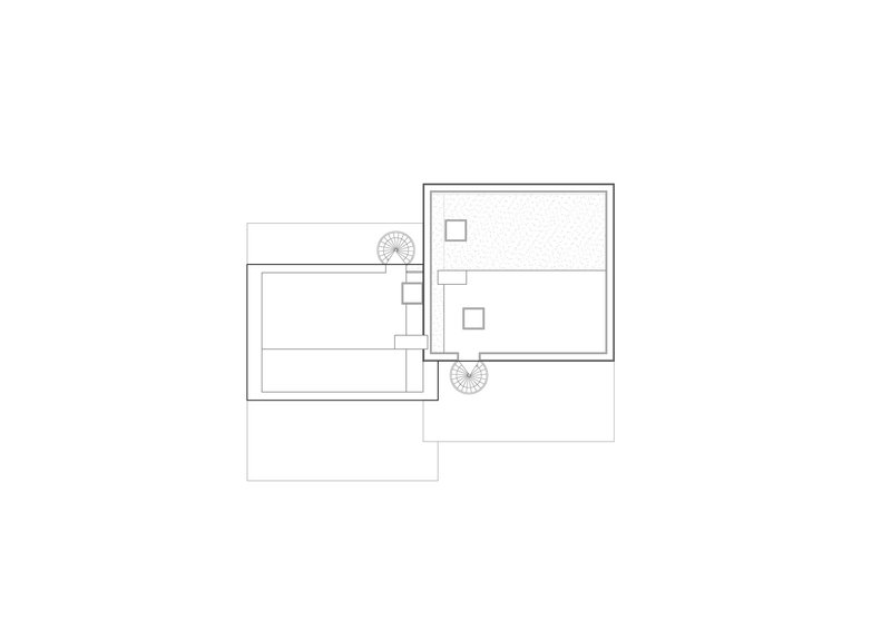 Floor plan drawing showing three offset rectangular volumes connected by a central circulation zone with planted elements