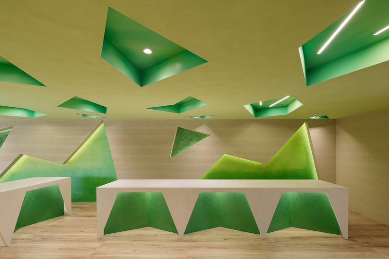 Counter and wall detail with multiple green triangle inserts at different scales