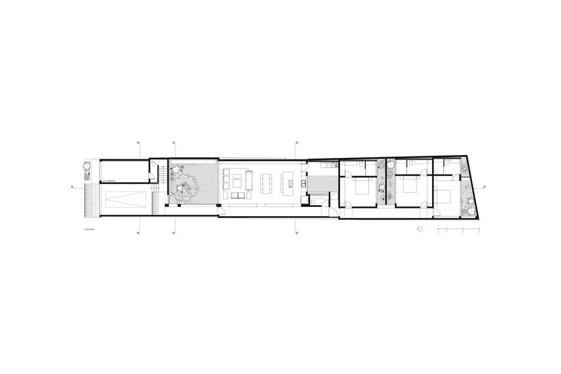 Floor plan showing a narrow residence with courtyard, living areas and three bedrooms in sequence
