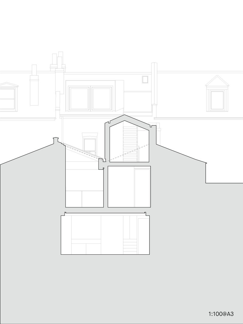 Section drawing revealing a gabled addition rising between neighbouring rooftops with existing party walls