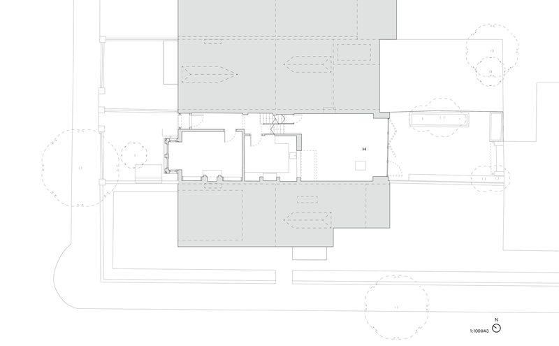 Floor plan drawing showing a central staircase with rooms and terraces arranged around it