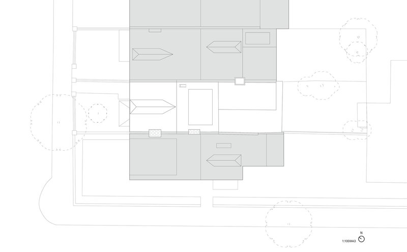 Roof plan drawing showing pitched roof volumes and directional arrows indicating slopes