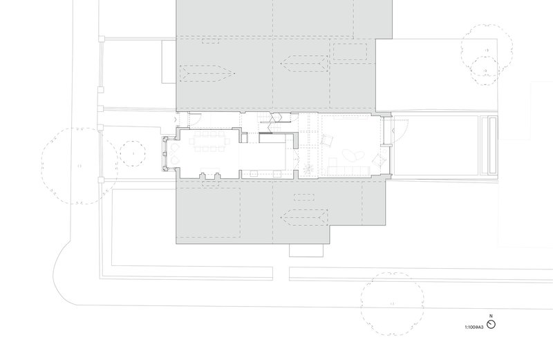 Floor plan drawing showing a central living space flanked by covered outdoor areas and landscape elements