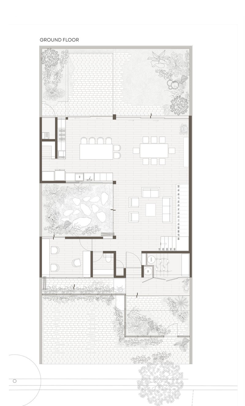 Ground floor plan showing open living area flanked by courtyards with planted gardens