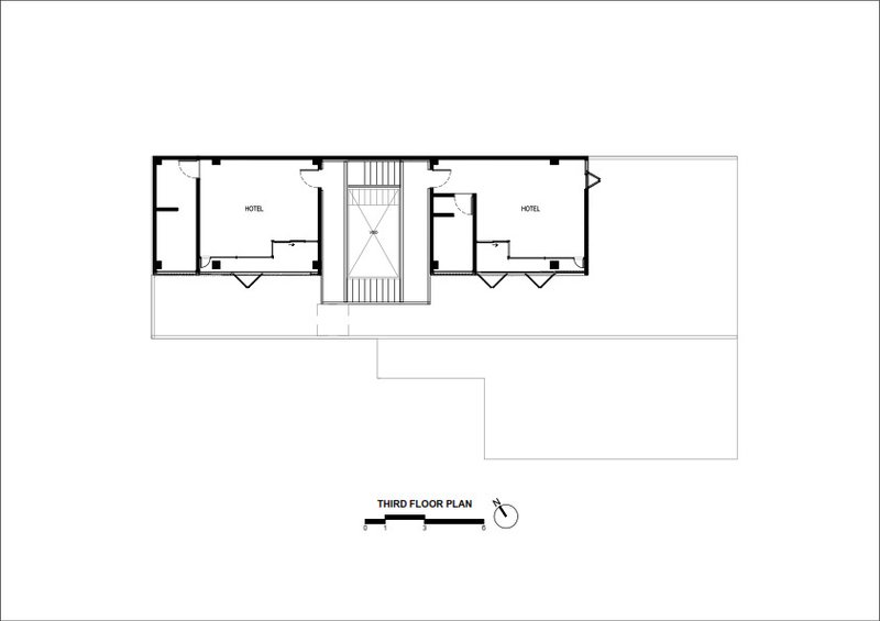 Third floor plan drawing showing two hotel rooms flanking a central stairwell
