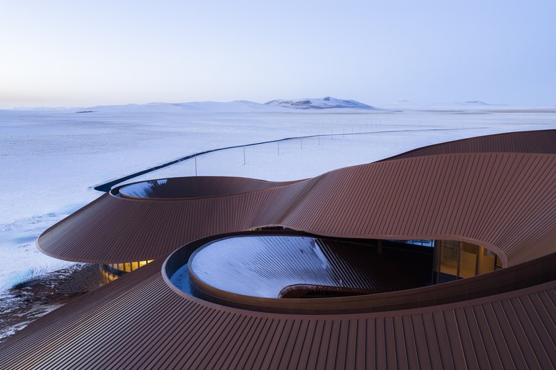 Rooftop view of the lobes meeting around a central skylit court