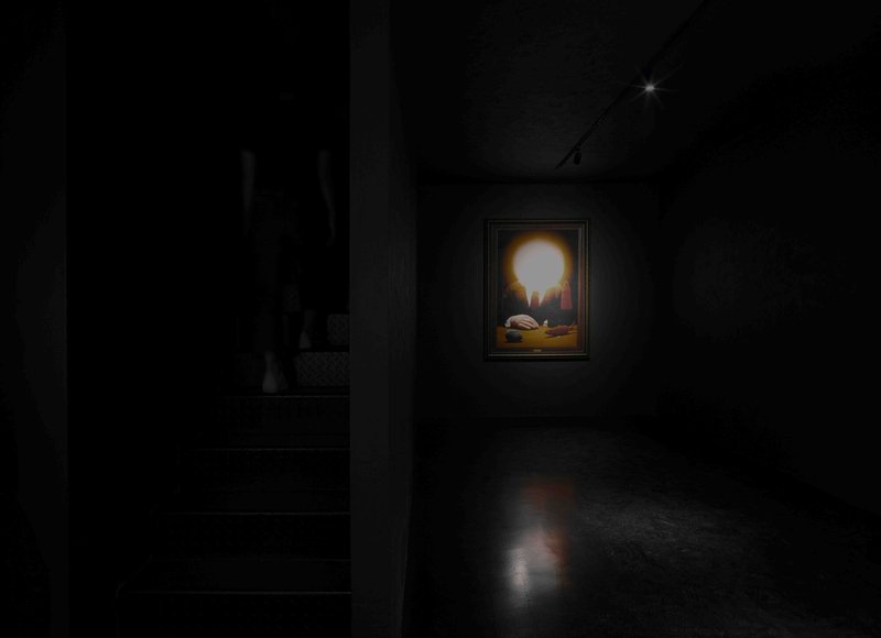 Illuminated painting on a dark gallery wall casting a soft glow onto polished concrete flooring