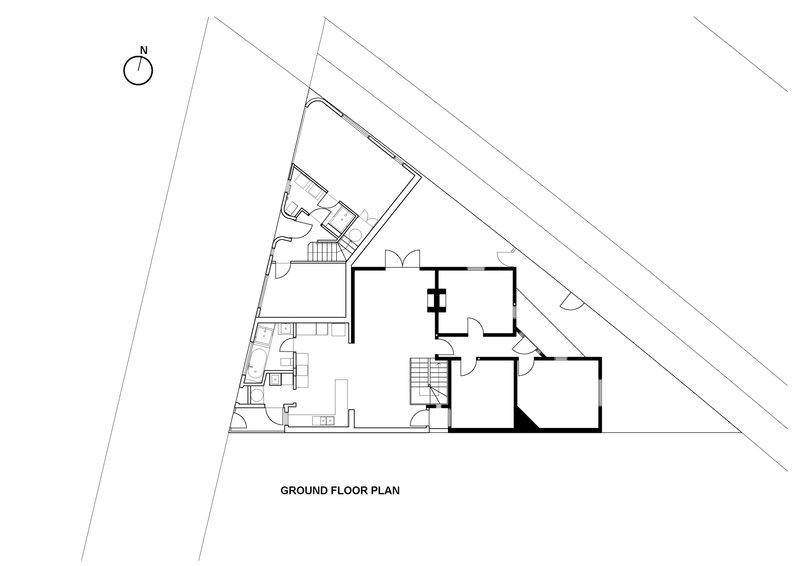 Ground floor plan drawing showing angular site boundaries with rooms arranged around a central stair core