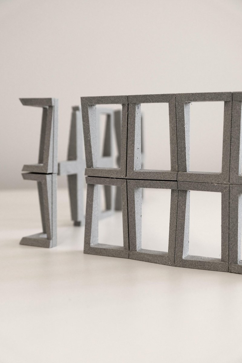 Physical model showing precast concrete structural frame components with open window apertures