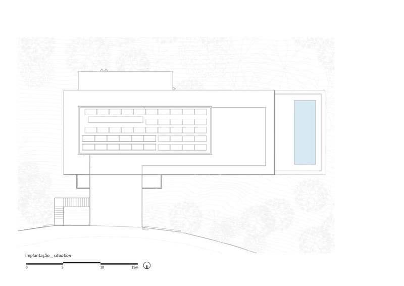 Site plan drawing showing a rectangular volume with a swimming pool on sloping terrain