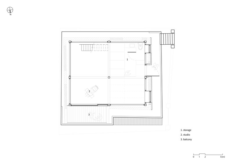 Upper floor plan drawing showing studio space, storage and balcony with exterior staircase