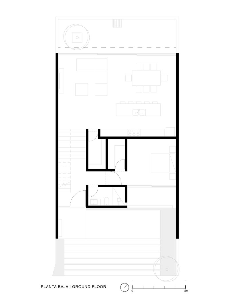Ground floor plan showing open living area with stair and two service rooms