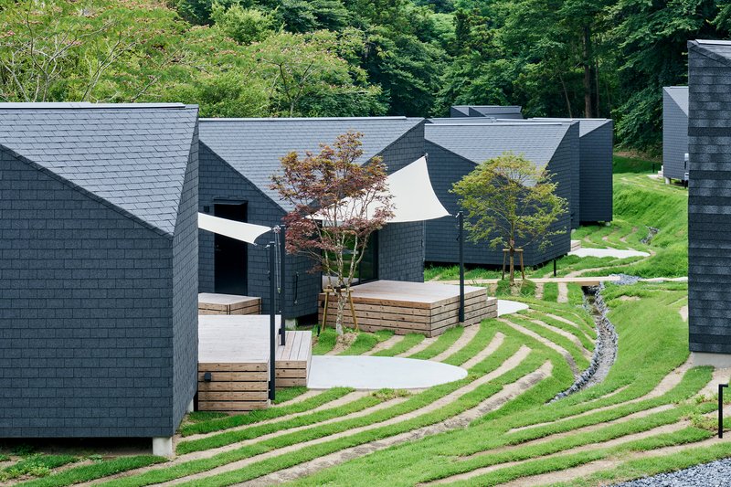 Tatsuro Sasaki Architects Scatters a Village of Timber Cabins Across a Japanese Satoyama Hillside