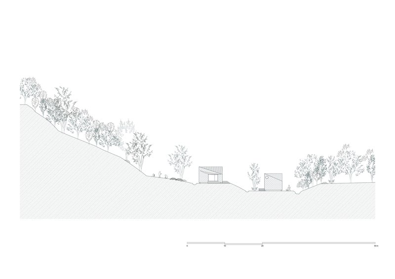 Site section drawing showing two small structures nestled into sloping terrain with scattered trees